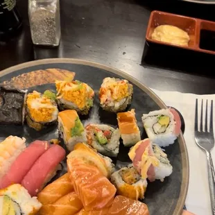 Maybe my third plate of sushi. With delicious salmon and tuna