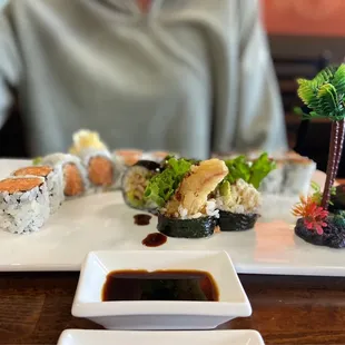 a plate of sushi and a small palm tree