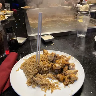 a plate of chicken and rice