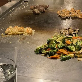 a large grill with various types of food on it