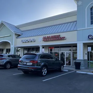 cars parked in front of the restaurant