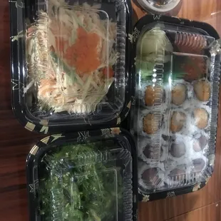 Spicy Scallop Roll, tuna Salmon and Tuna Roll, Kani Salad, and Seaweed Salad