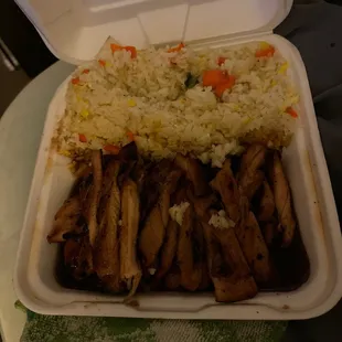 Chicken teriyaki with fried rice.