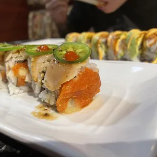 a plate of sushi rolls