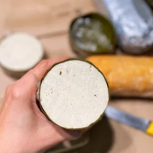 a person holding a glass of beer