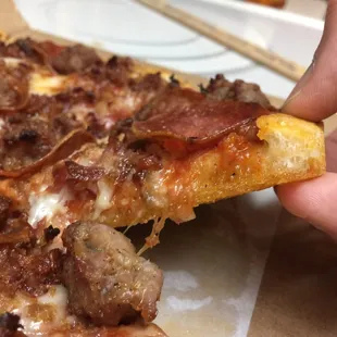 Small Lembo&apos;s Traditional pizza with pepperoni, sausage, and bacon.