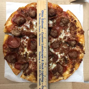 Small Lembo&apos;s Traditional pizza with pepperoni, sausage, and bacon.