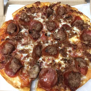 Small Lembo&apos;s Traditional pizza with pepperoni, sausage, and bacon.