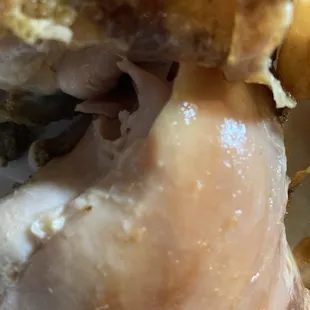 1/2 chicken dark meat. One portion is moist and the other is old and dry. In the same container. Nasty!