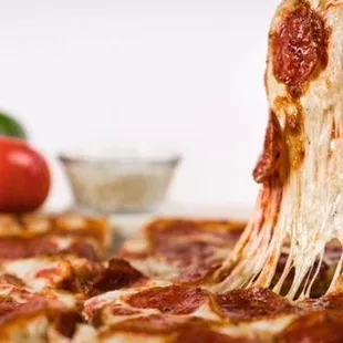 a slice being lifted by a fork
