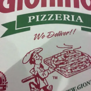a man carrying a pizza