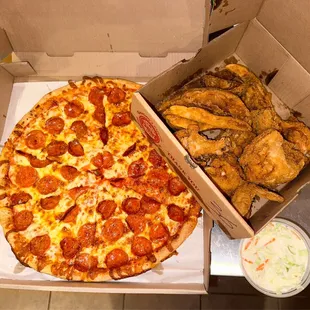 Every day special - Family Feast - 1 topping pizza, 8 pc. GOOD fried chicken, tasty coleslaw and Jo Jos. Great value $34. 95.