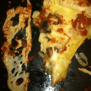 Stuffed Pizza Undercooked Stuffed Pizza (On the left, that is NOT CHEESE, but RAW DOUGH).