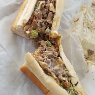 a sandwich with meat and cheese