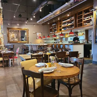 a dining area with tables and chairs