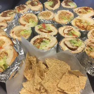 a variety of burritos and chips