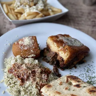 Moussaka, pilaf, roast potato, pita, Greek fries.