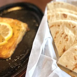 The Saganaki cheese which is flamed in kitchen. Fluffy soft warm pita. Happy hour $9, yum