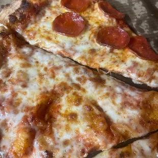 two slices of pepperoni pizza