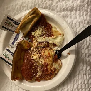 a plate of food on a bed