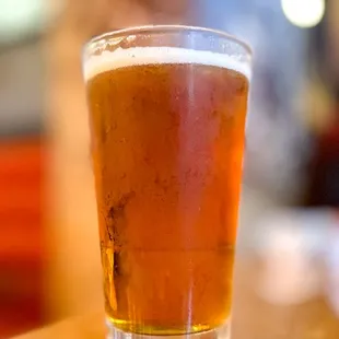 a glass of beer on a table