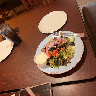 a plate of salad on a table
