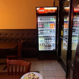 a pizza and a salad on a table