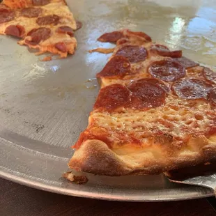 was.. half pepperoni half cheese thin pizza