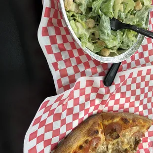 a slice of pizza and a salad