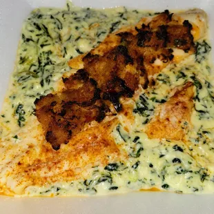 Crab-stuffed Halibut over parmesan-creamed spinach.