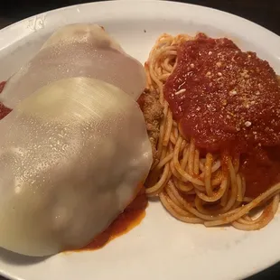 Lunch portion of Chicken Parmesan with spaghetti.