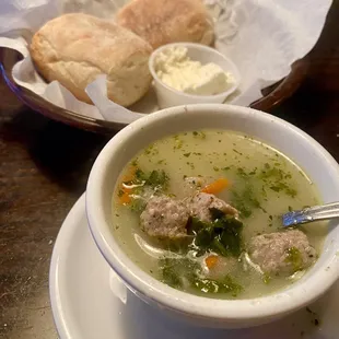 Wedding soup and warm rolls with whipped butter.