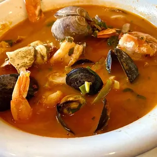 Cioppino: mussels, clams, shrimp, calamari, and fish in tomato broth