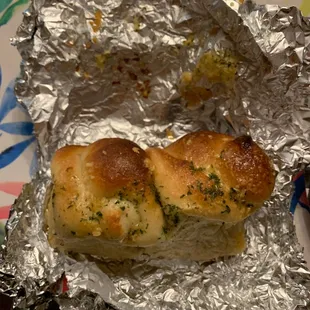 two pieces of bread wrapped in tin foil