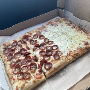 Half pepperoni half cheese pizza