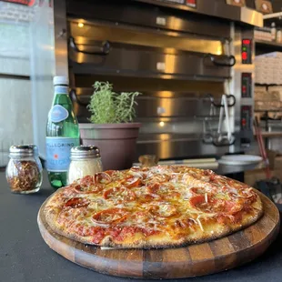 a pizza on a wooden board