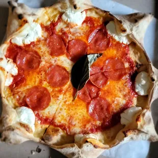 a pepperoni and mozzarella pizza