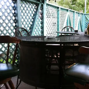 a patio with a table and chairs