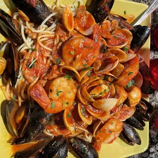 a plate of seafood and pasta