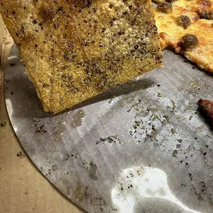 This is how greasy the pizza is and you can see the sausage is in little chunks when usually it&apos;s ground up like hamburger meat.