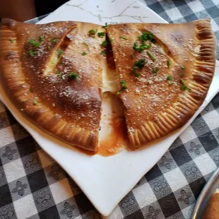 Large pepperoni,  olives,  and  mushroom calzone