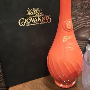 a bottle of wine and a glass