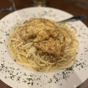 a plate of pasta with shrimp