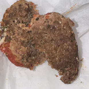 One of the meatballs, it looks freezer burnt &amp; very dry that the sauce isn't even sticking to it like it would have on a fresh meatball!