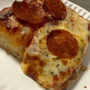 A slice of Sicilian Pepperoni