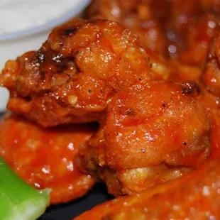 Wing's w/ our very own hot sauce. Mild, Med. or hot.