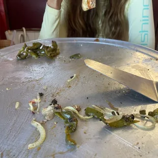 a woman eating a slice of pizza