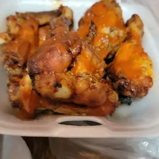 chicken wings in a styrofoam container