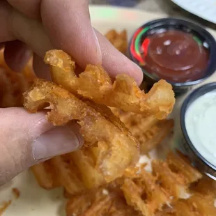 Crosscut potatoes, unfortunately hard, dry and oily.