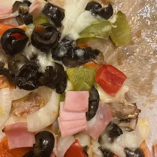 Their greasy, soaked crust olive &quot;special&quot; pizza. Nice job spreading the ingredients. It was like that all over the pizza.